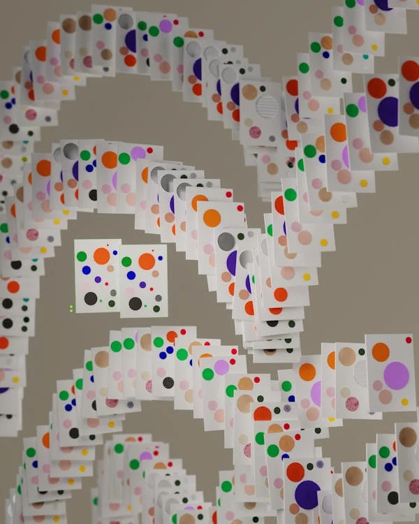 Numerous cards with colorful circles arranged in cascading arcs.
